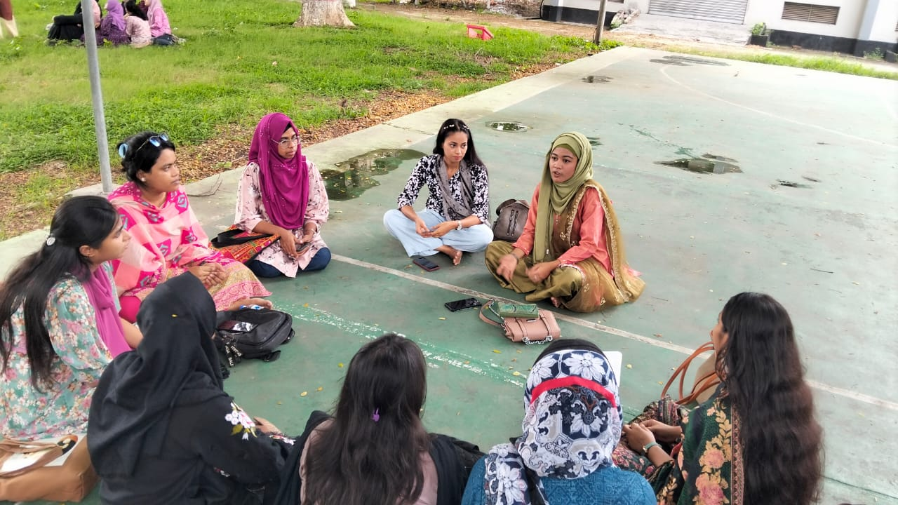 Women taking part in a community discussion