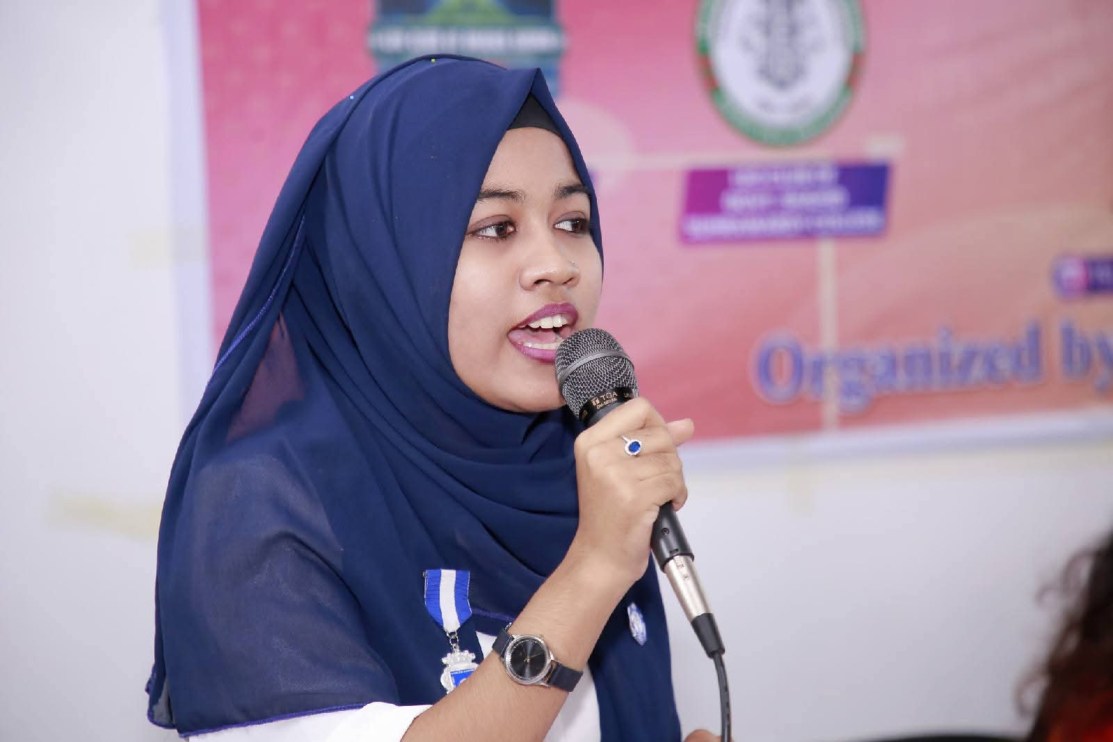 A young participant speaking at an event